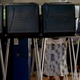 Voters fill out their ballots during the early voting period at a voting station set up at a government building in Miami Oct. 28, 2014.
Joe Raedle/Getty Images